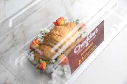 The croissant corsage comes packaged in a tidy plastic box.