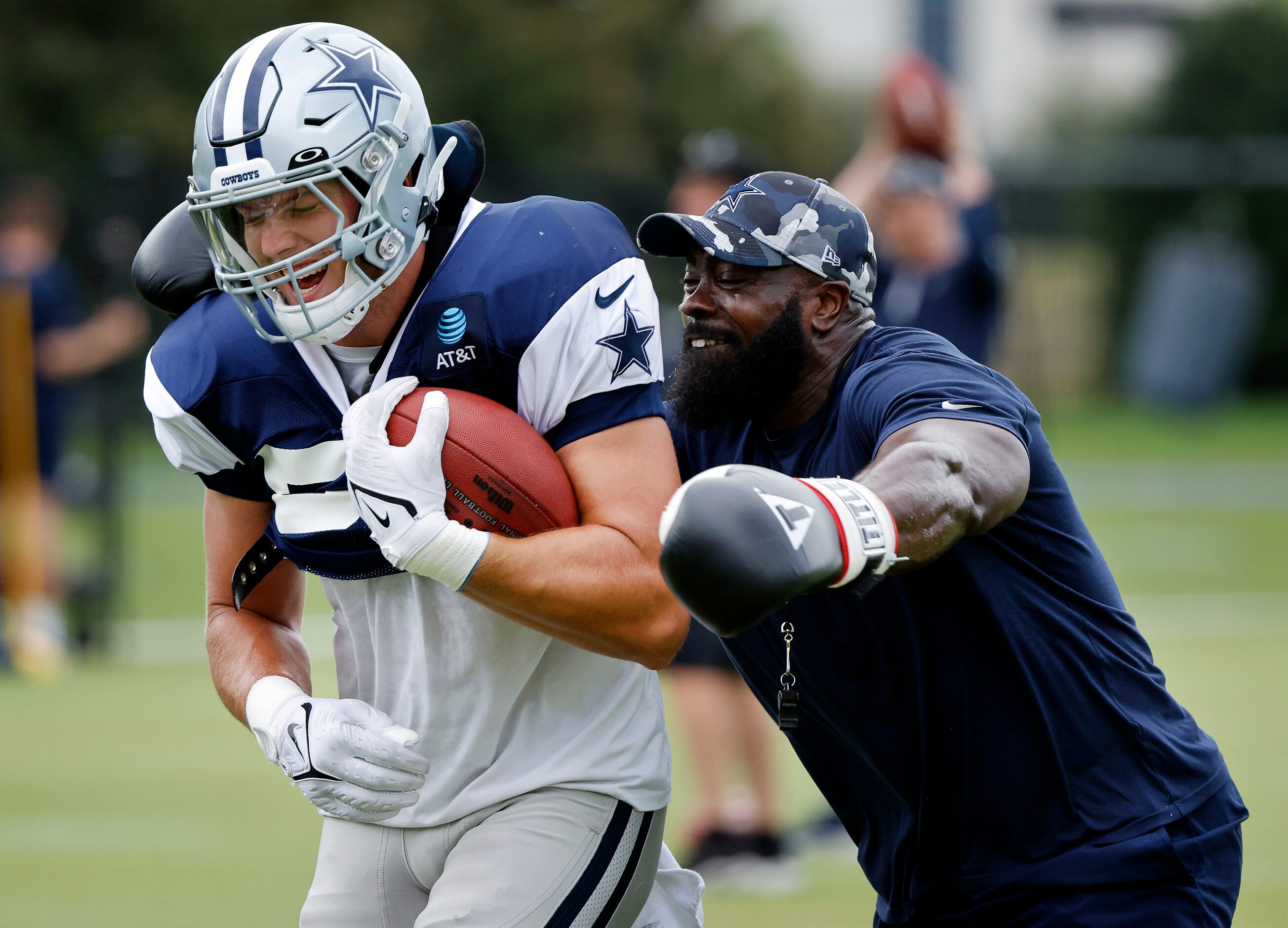 With his boxing gloves, Dallas Cowboys assistant strength and conditioning coach Kendall...