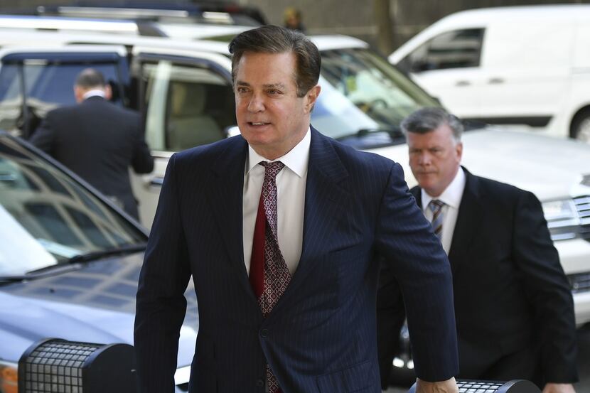 (FILES) In this file photo taken on June 15, 2018 Paul Manafort arrives for a hearing at US...