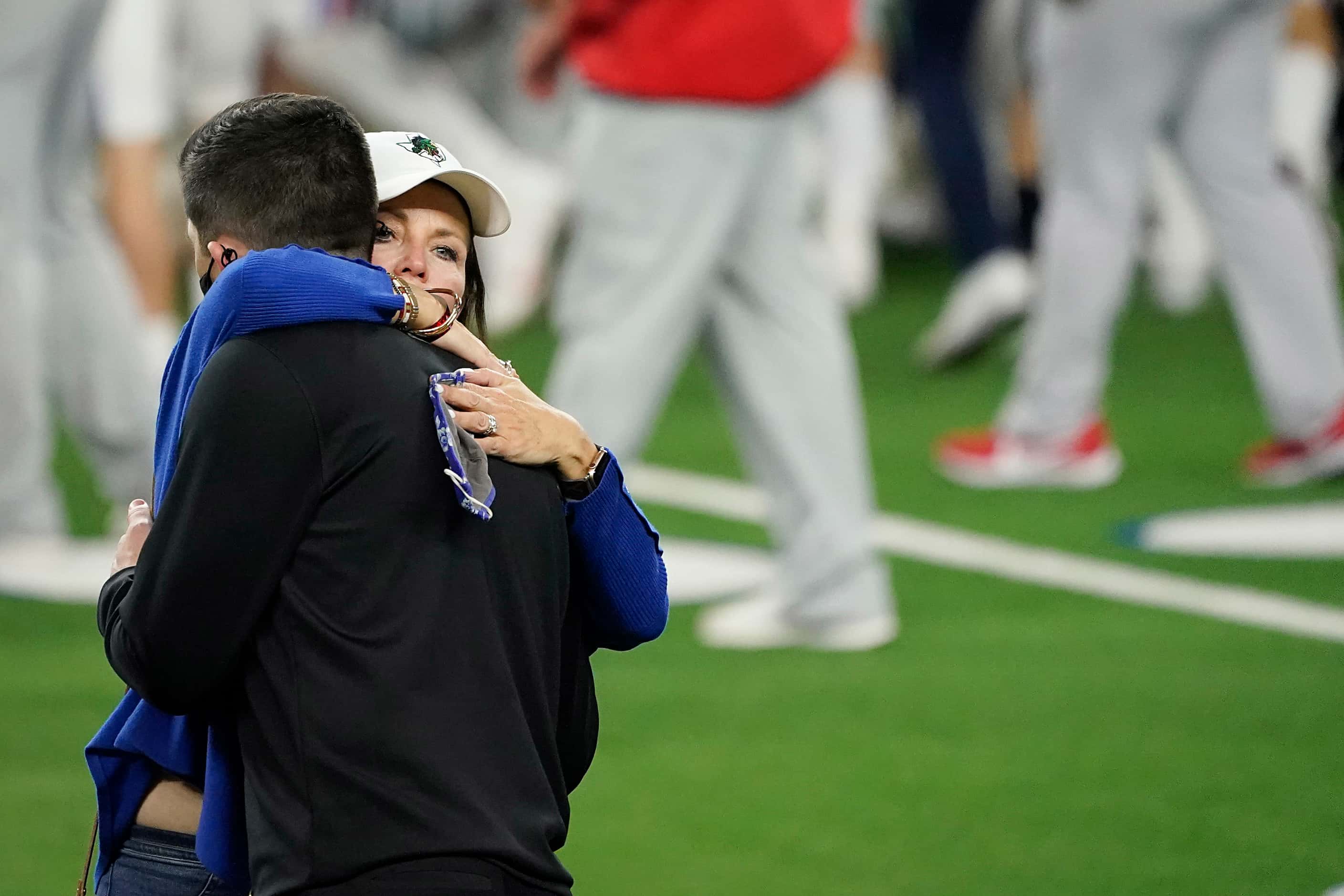 Southlake Carroll head coach Riley Dodge gets a hug from his mother Elizabeth Dodge after a...