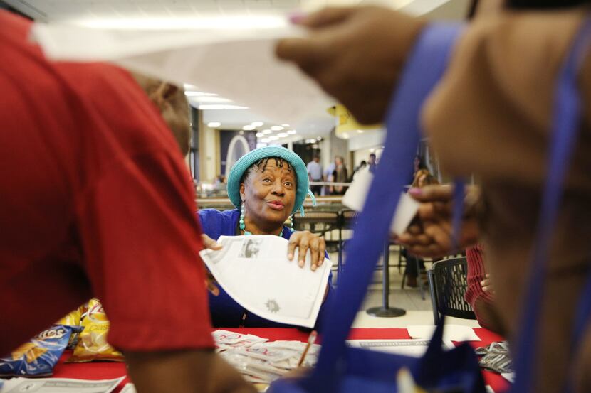 Helen Turner Goldenberg speaks with guests at a World AIDS Day health fair at El Centro...