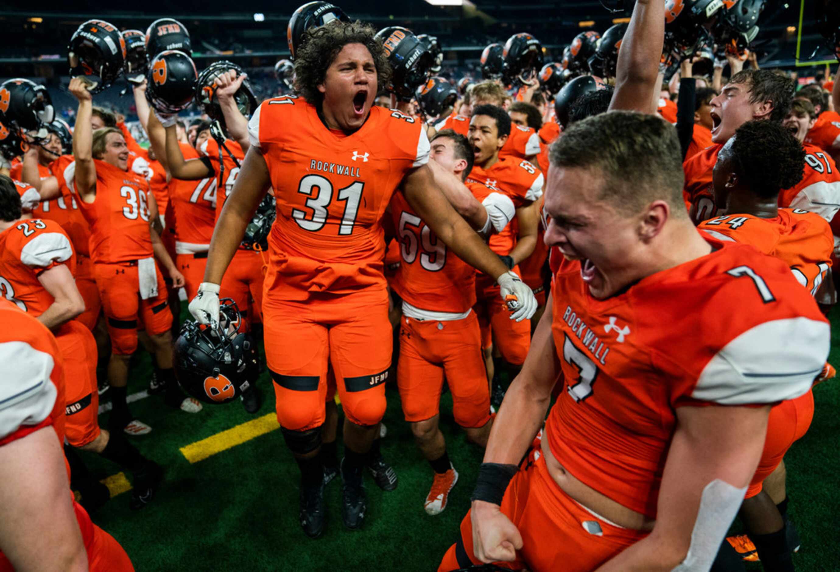 Rockwall celebrates a 60-59 win over Allen in a Class 6A Division I area-round high school...