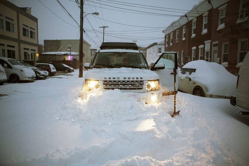  A Land Rover is stuck in a snow drift as snow continues to fall on January 23, 2016 in...