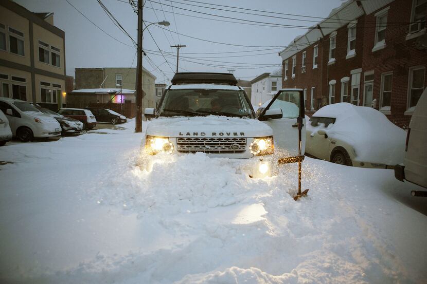  A Land Rover is stuck in a snow drift as snow continues to fall on January 23, 2016 in...
