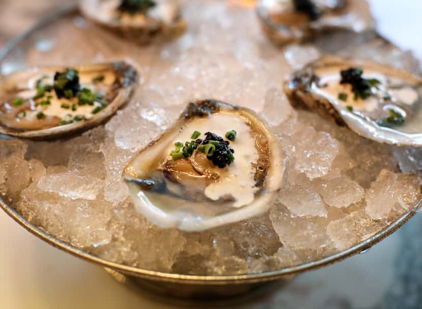 Oysters at Green Point Seafood & Oyster Bar come dressed with Champagne vinaigrette,...