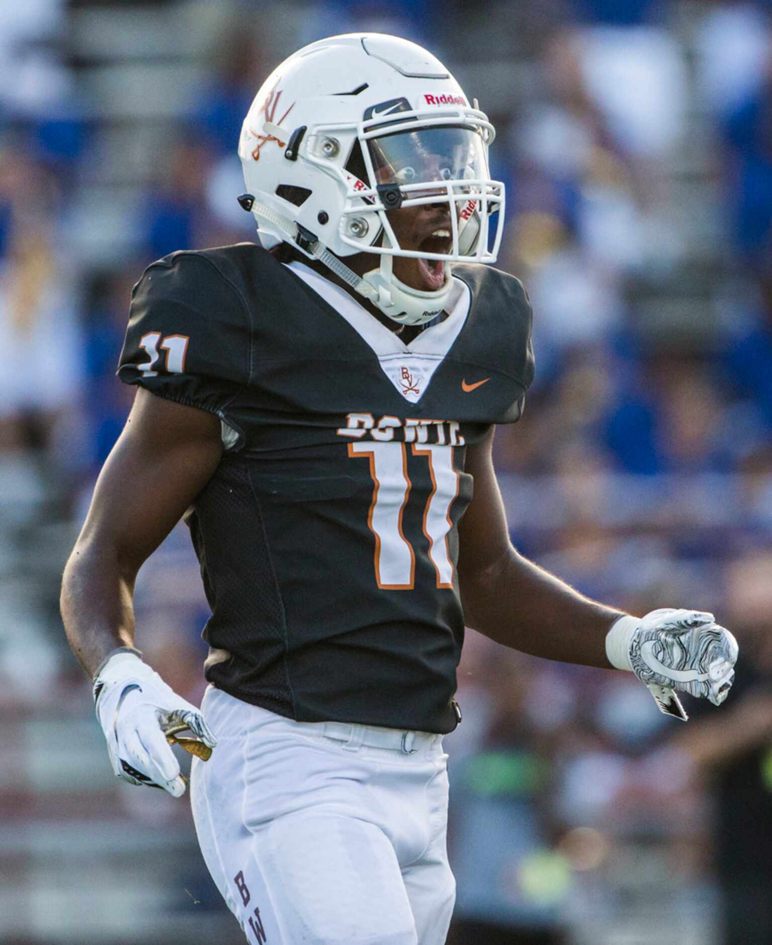 Arlington Bowie defensive back Jalen Curvin (11) reacts to a penalty call during the first...