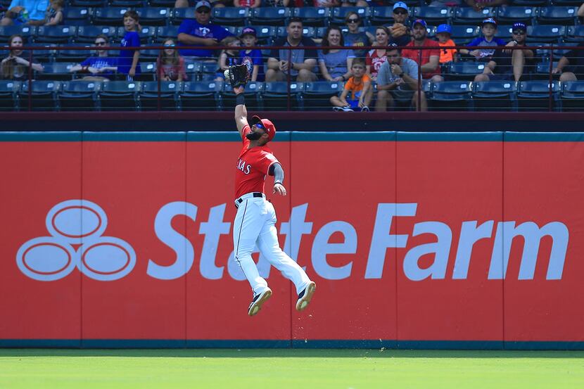 ARLINGTON, TX - SEPTEMBER 19:  Nomar Mazara #30 of the Texas Rangers fails to make the catch...