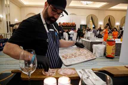 Chef David Uygur adds head cheese to a plate at Cochon555 in 2019. 2020 will be the food...