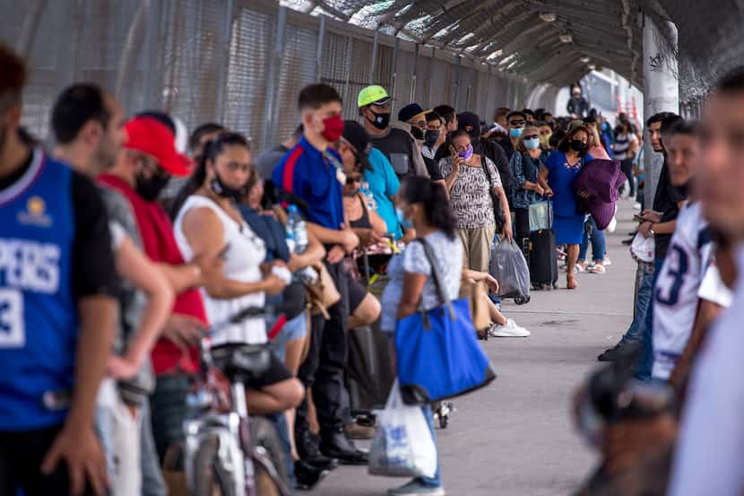 People wait in line to cross the border to El Paso, Texas through the Paso Del Norte Port of...