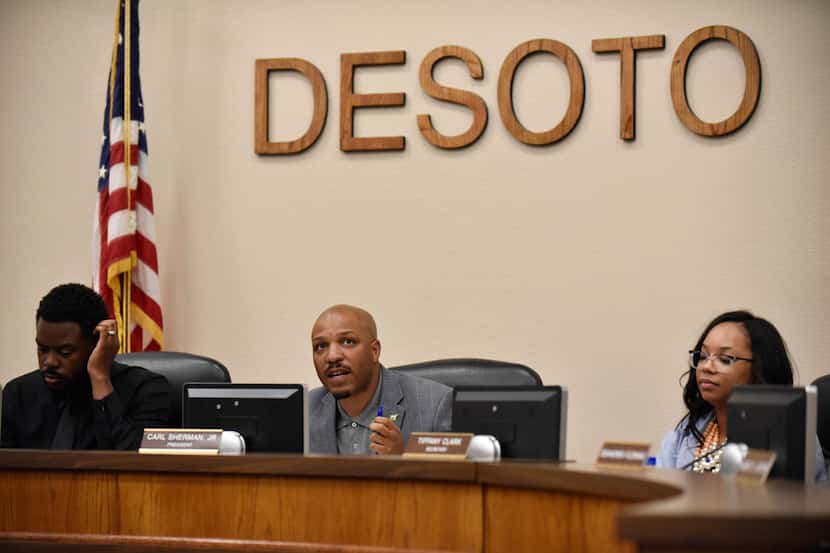 DeSoto ISD president Carl Sherman, Jr., second from left, begins a meeting to vote on...