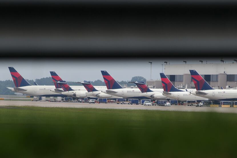 Delta planes were parked at gates at Atlanta's Hartsfield International Airport on Monday...