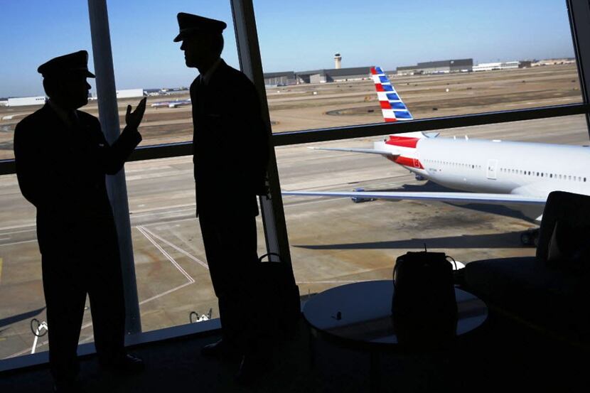 American Airlines pilots talked after the carrier's merger with US Airways was announced in...