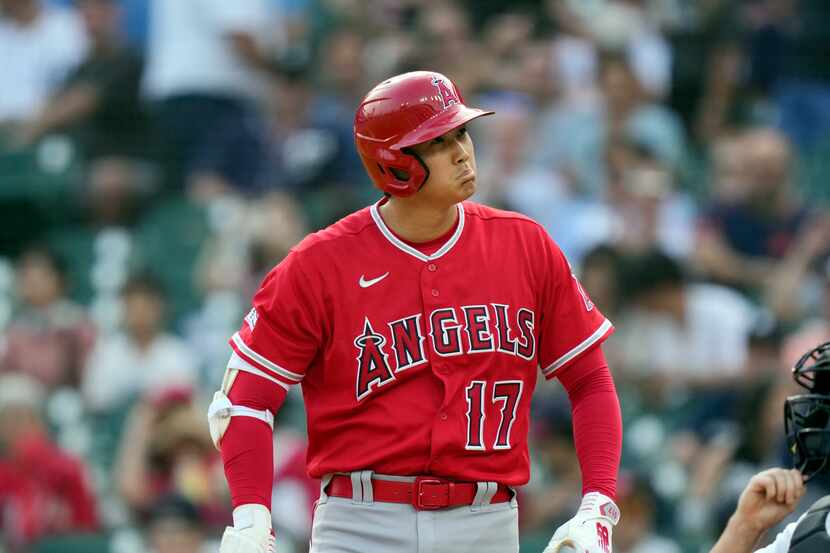 Los Angeles Angels designated hitter Shohei Ohtani reacts after a call strike during the...