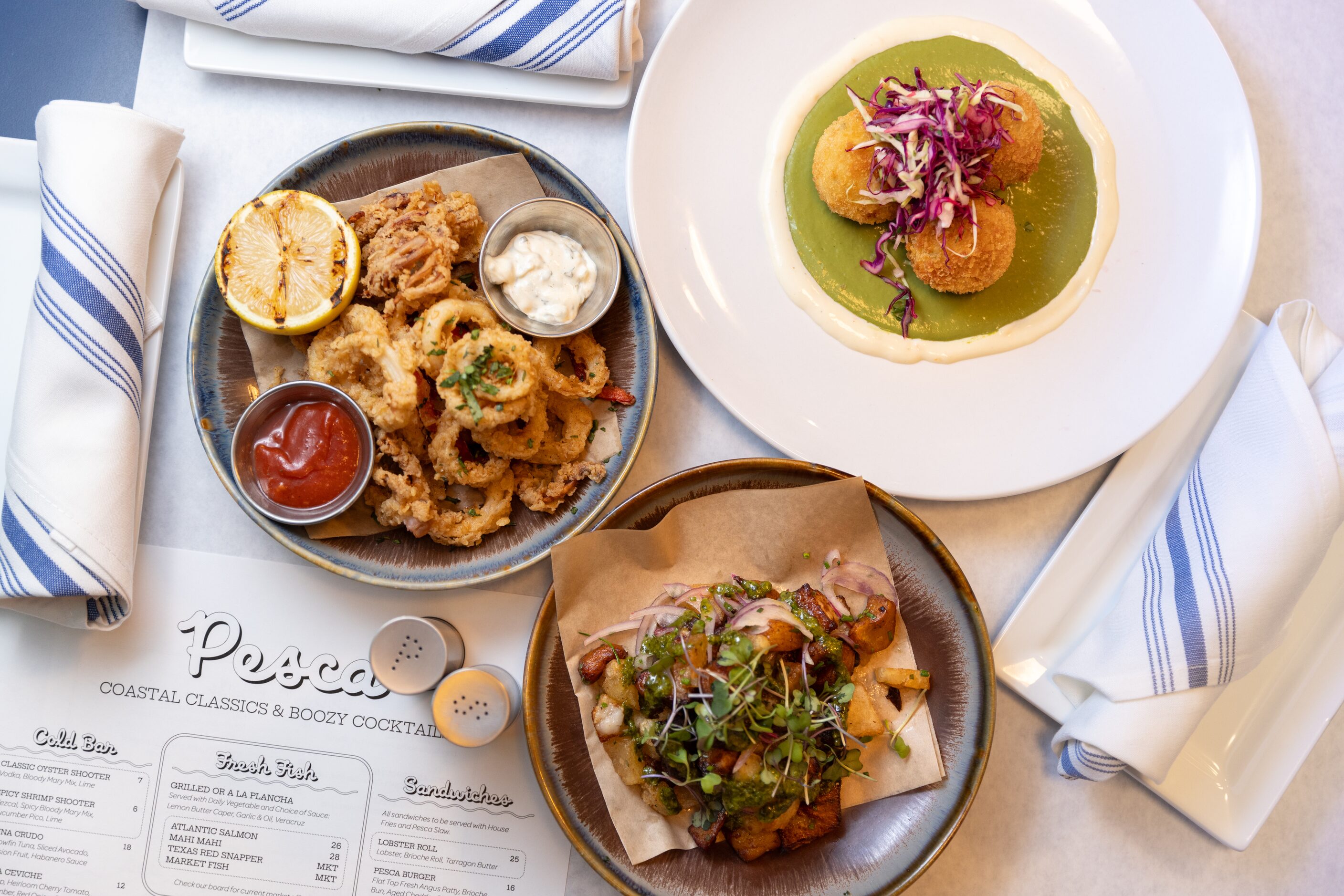 Fried calamari, crab croquettes and pork belly ceviche are all on the menu at Pesca, in...