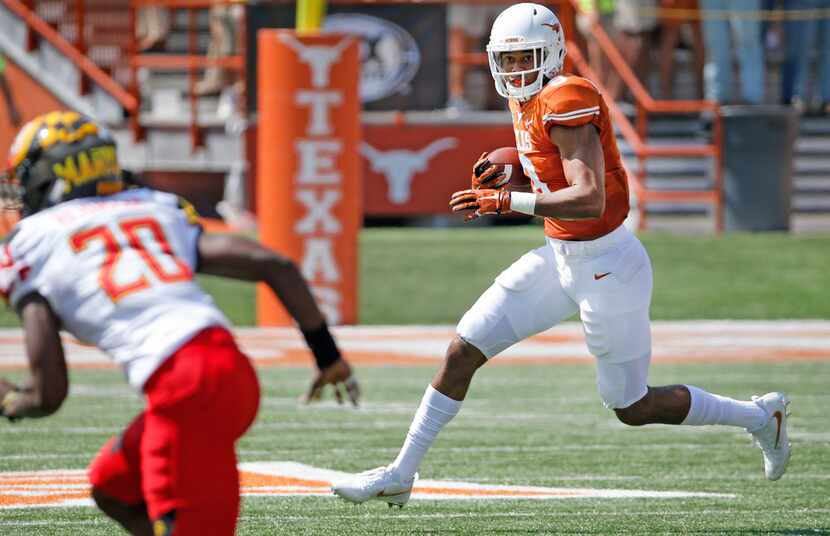 FILE - Texas Longhorns wide receiver Collin Johnson (9) runs for yardage after a pass catch...