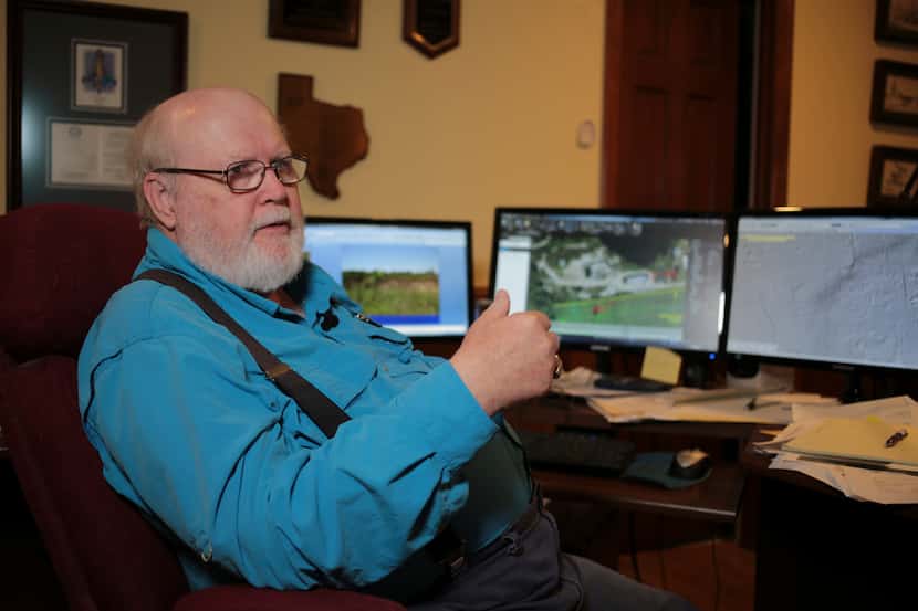 Geologist Richard Howe sits at his home office in suburban Houston Tuesday as he discusses...