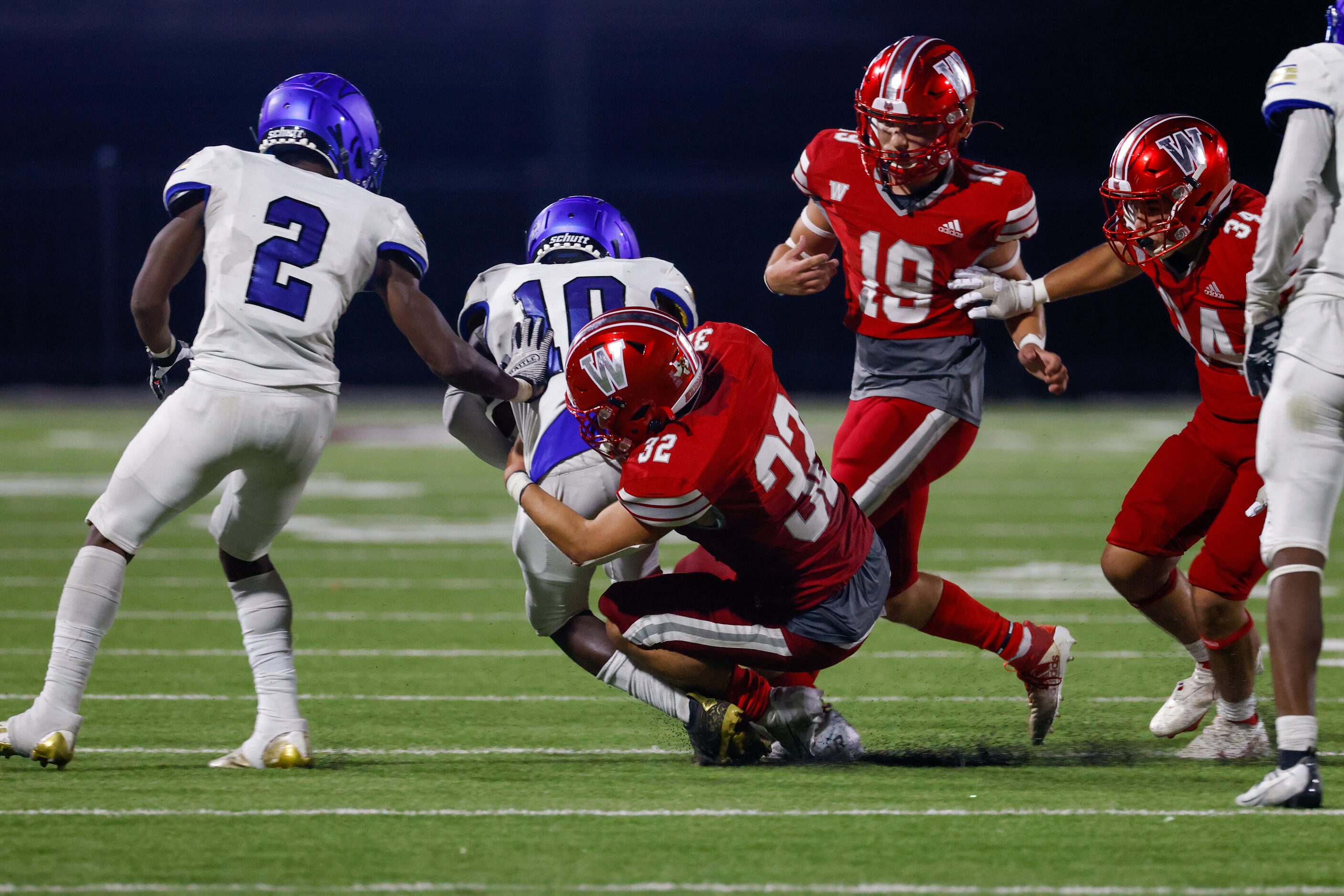 Woodrow Wilson line backer Jayden Pena (32) tackles Conrad wide receiver Christian Byrum...