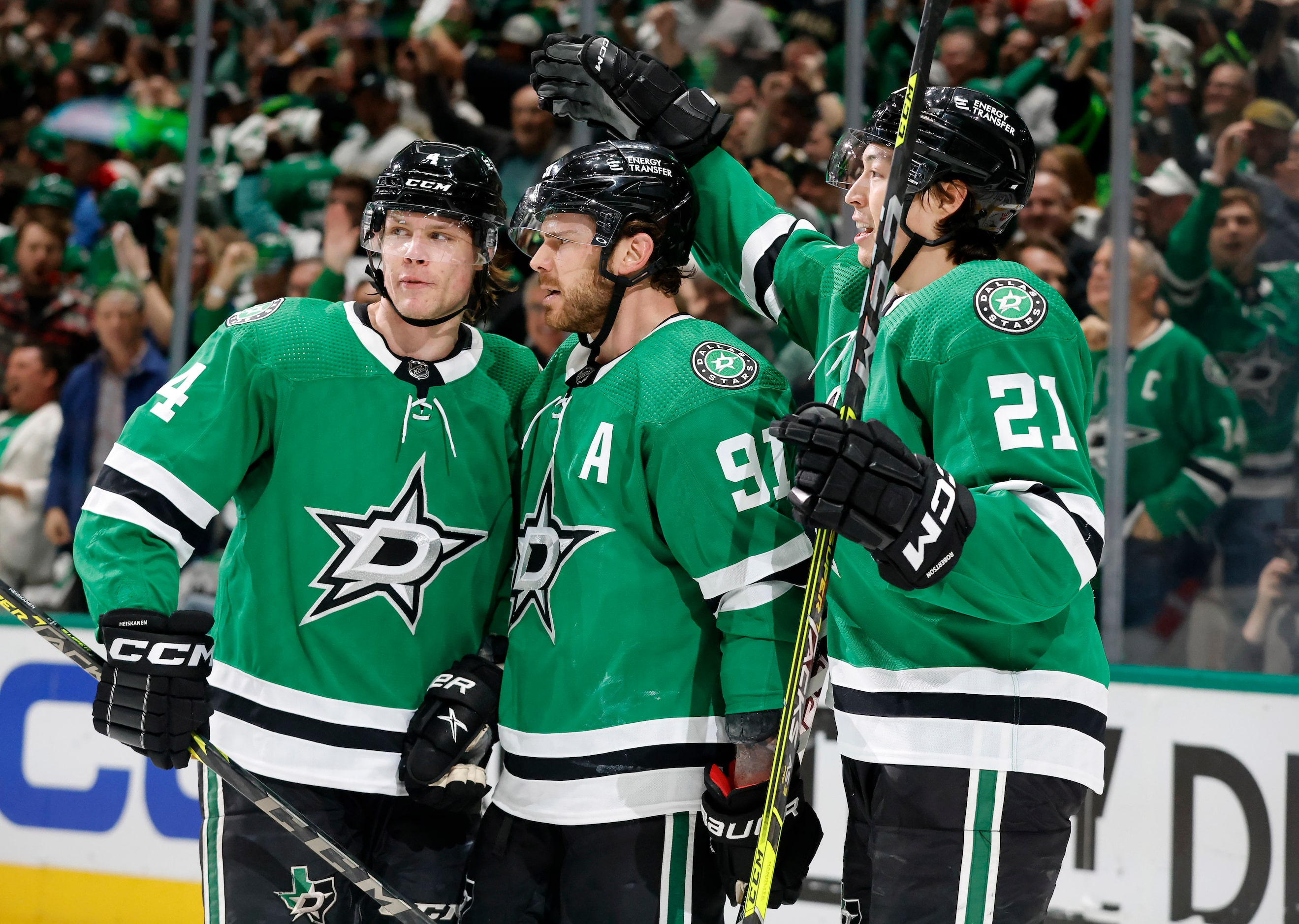 Dallas Stars left wing Jason Robertson (21) congratulates center Tyler Seguin (91) after he...