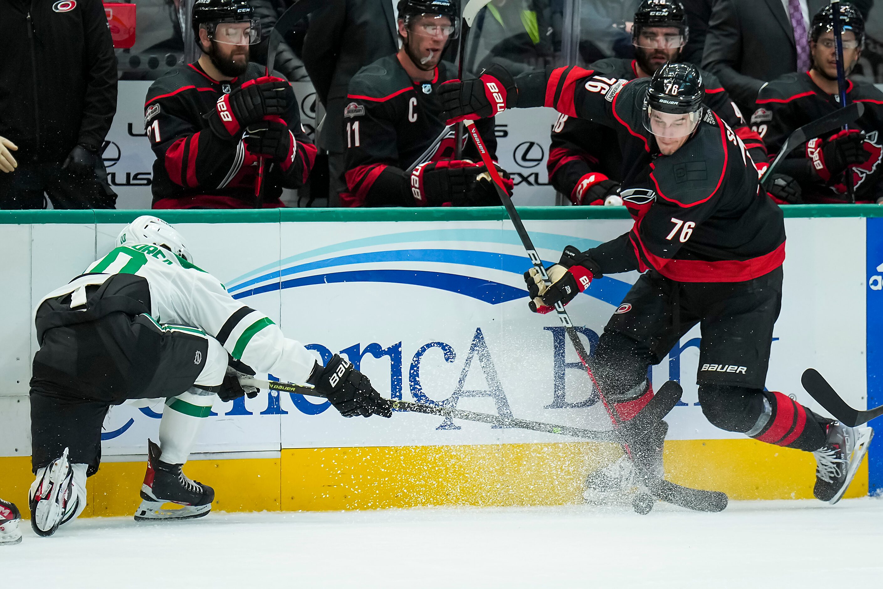 Carolina Hurricanes defenseman Brady Skjei (76) controls the puck against Dallas Stars...