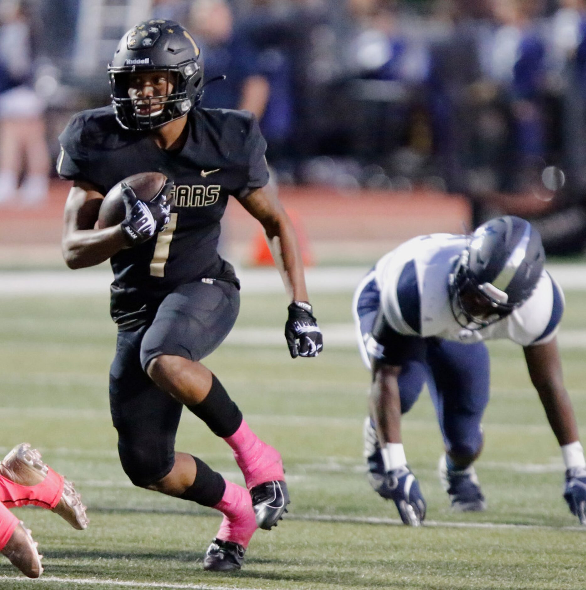 The Colony High School wide receiver Myles Price (1) during the first half as The Colony...