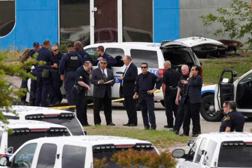 Law enforcement officials investigated the scene of a shooting by police outside Southwest...