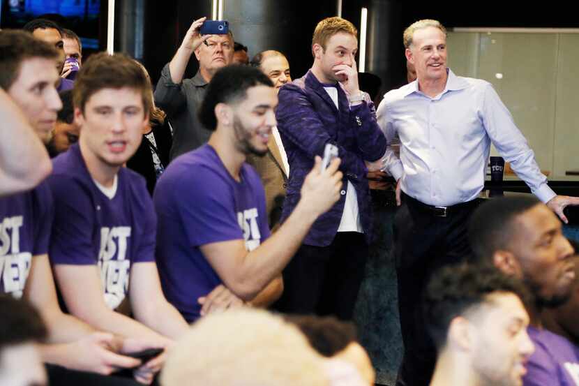 TCU Athletic Director Jeremiah Donati, in the purple blazer, and men's basketball head coach...
