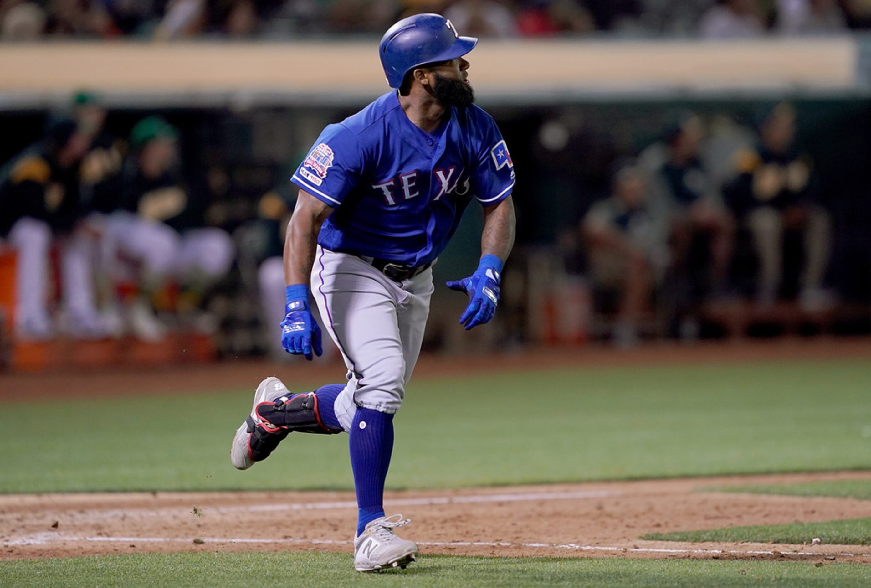 OAKLAND, CA - JULY 25:  Danny Santana #38 of the Texas Rangers trots up the line and watches...