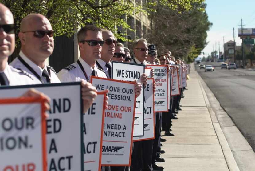  Southwest Airlines pilots picket near the Orleans Hotel and Casino in Las Vegas over the...