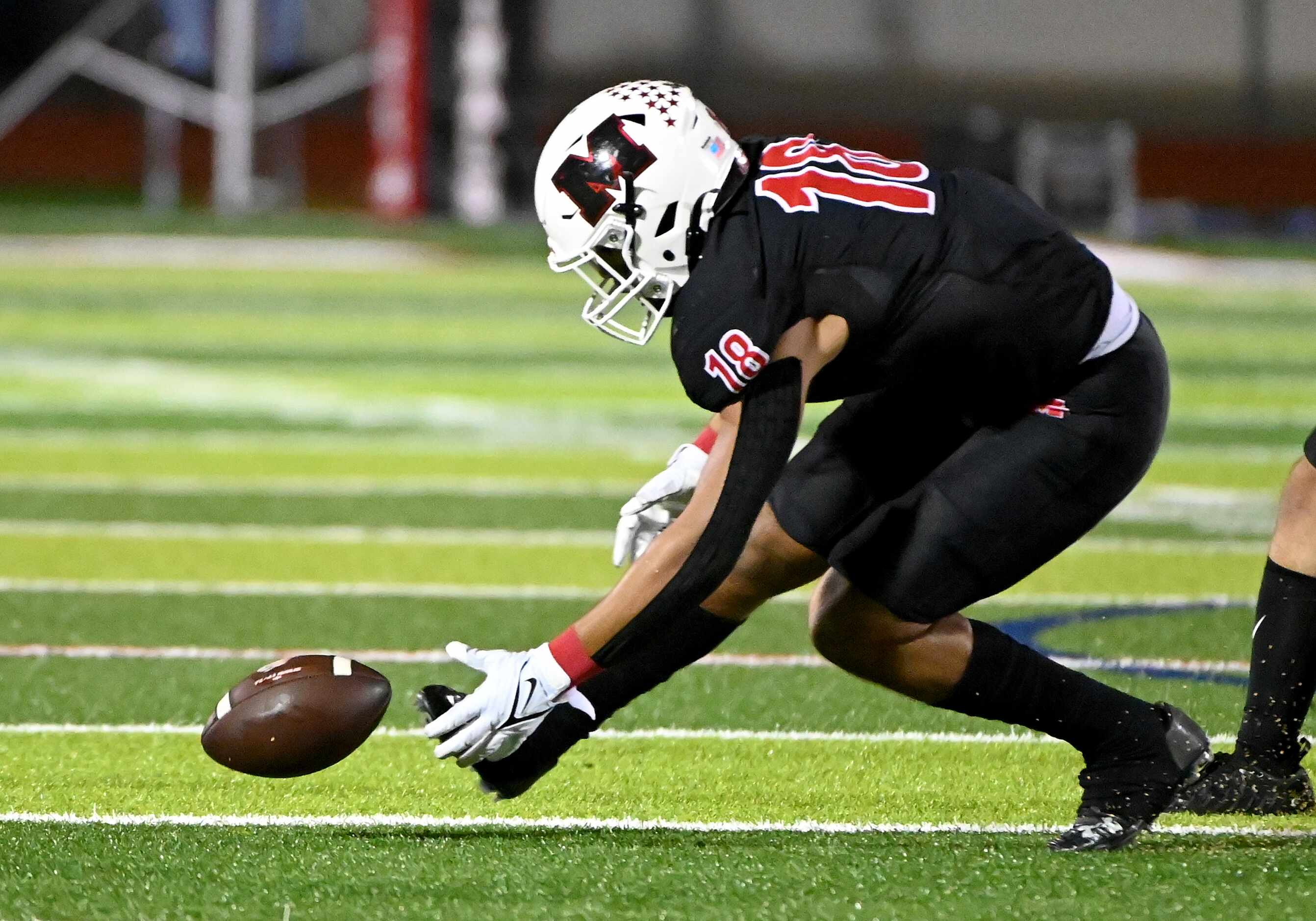 Melissa's Caleb Otlewski (18) recovers a fumble in the first half of a high school football...