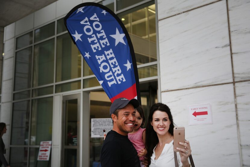 Carlos Aguirre and Melissa Aguirre of Richardson takes a selfie with their daughter, Mia...