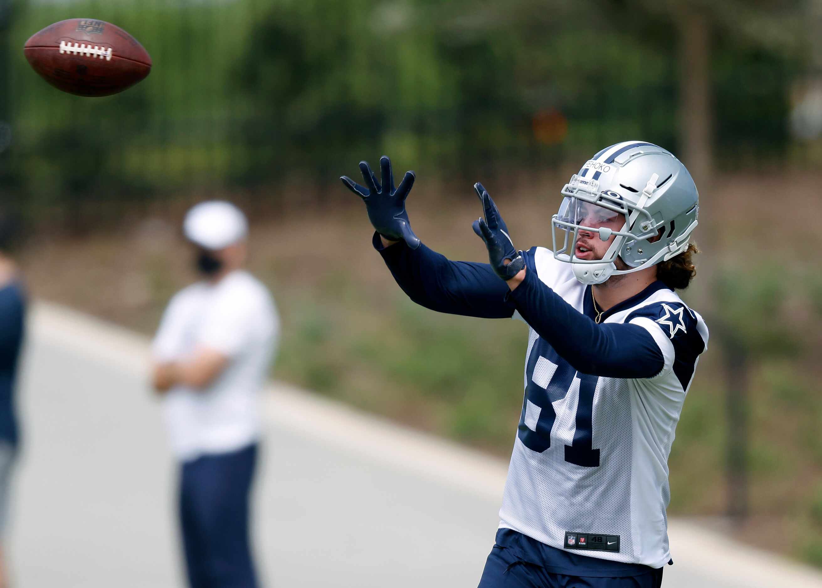 Dallas Cowboys rookie wide receiver Simi Fehoko (81) catches a ball during a rookie minicamp...