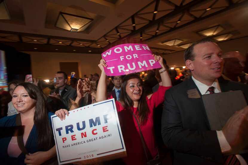 Supporters of Republican candidate Donald Trump cheer as election results come in during a...