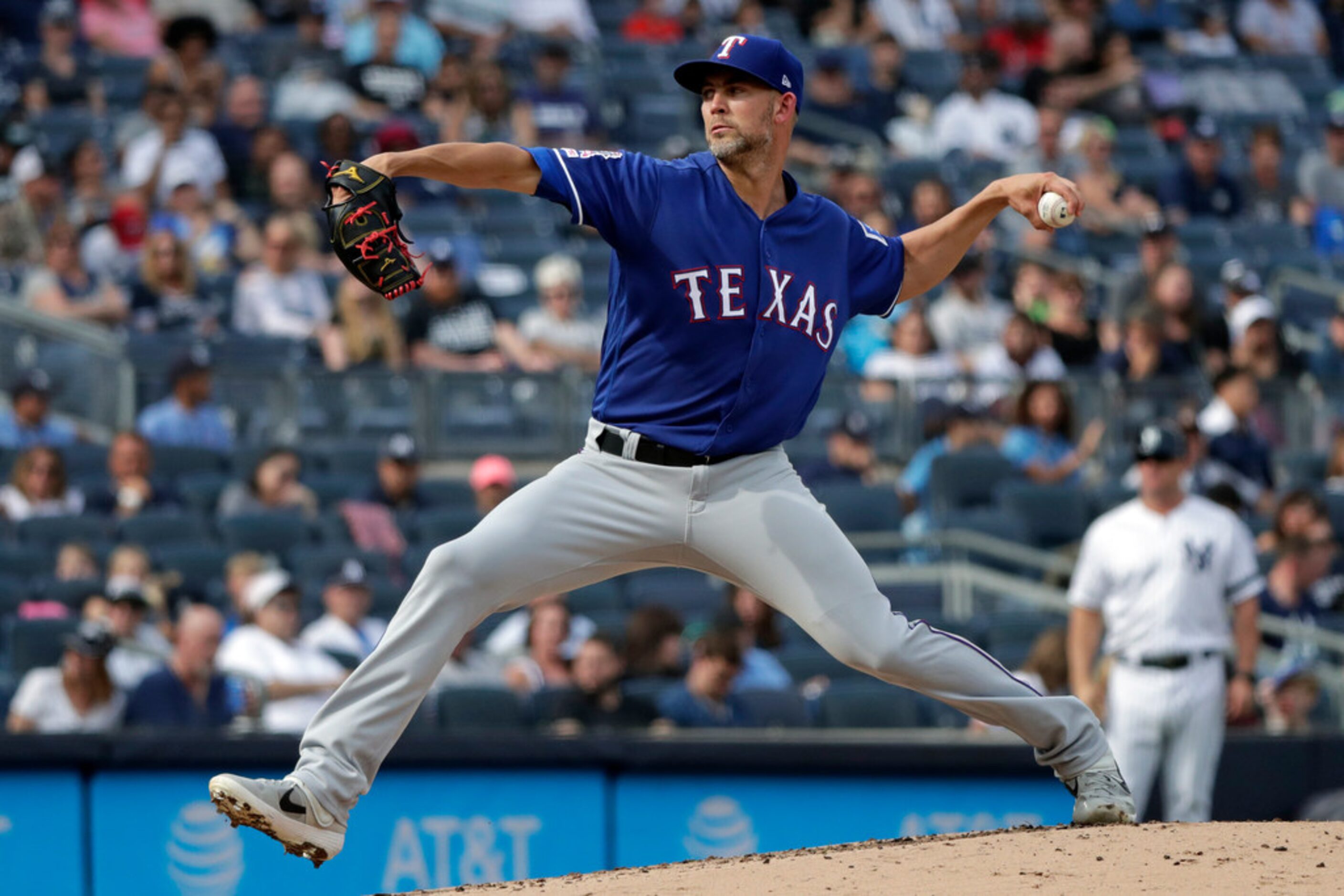 Texas Rangers pitcher Mike Minor delivers during the first inning of a baseball game against...