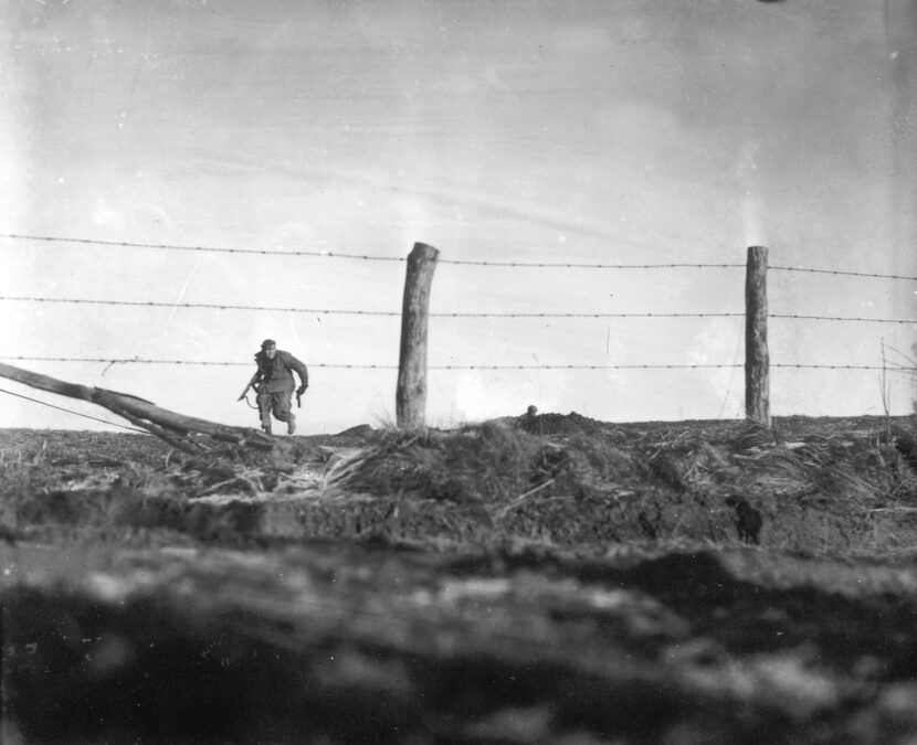 A soldier from the 82nd Airborne Division goes out on a one-man sortie while covered by a...