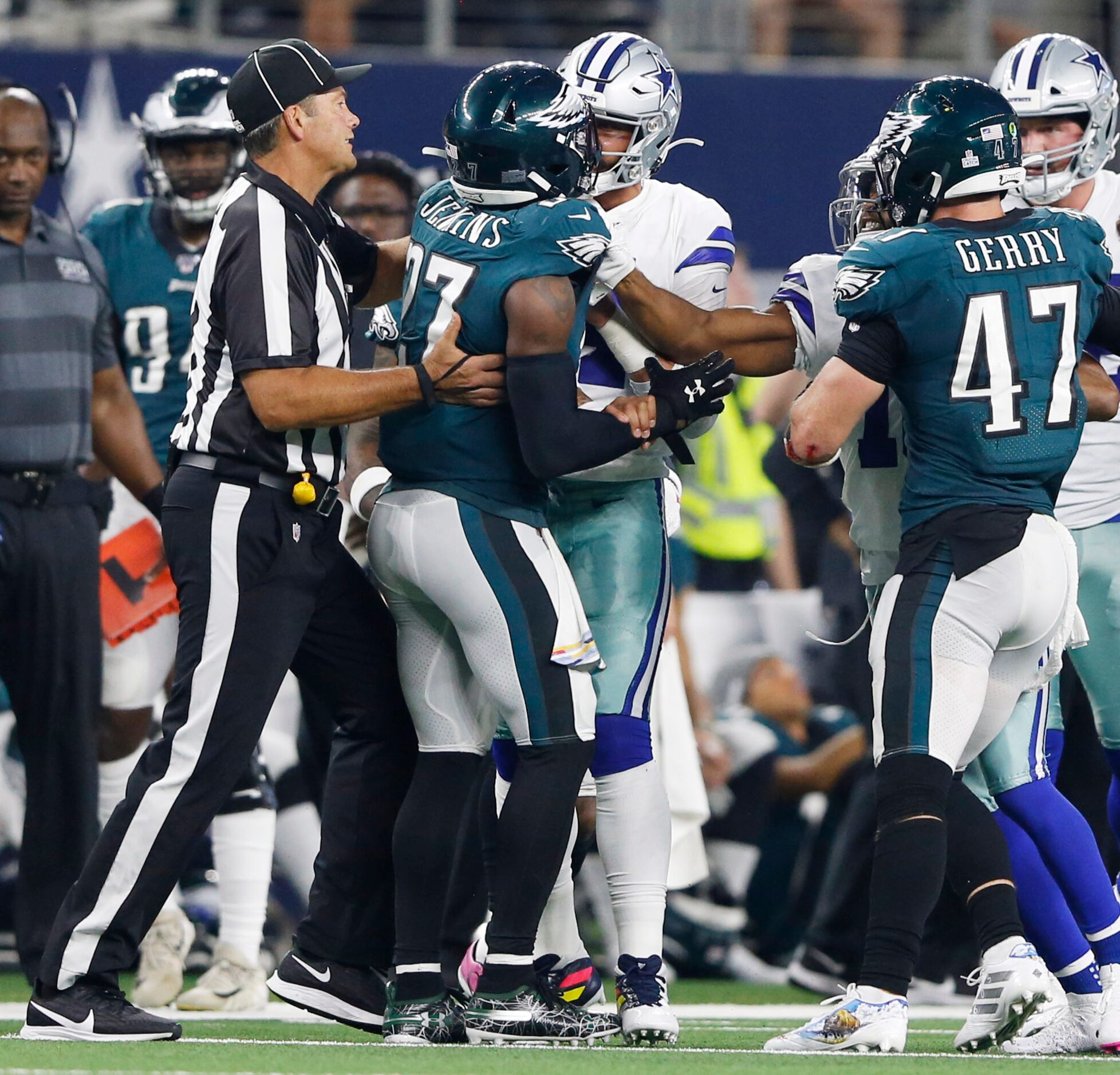 Dallas Cowboys quarterback Dak Prescott (4) gets into a argument with \Philadelphia Eagles...