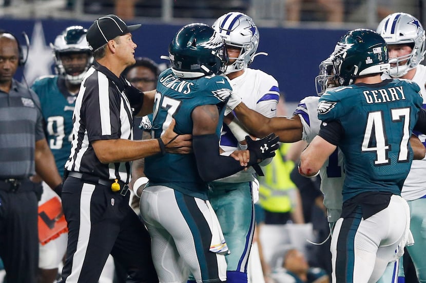 Dallas Cowboys quarterback Dak Prescott (4) gets into a argument with \Philadelphia Eagles...