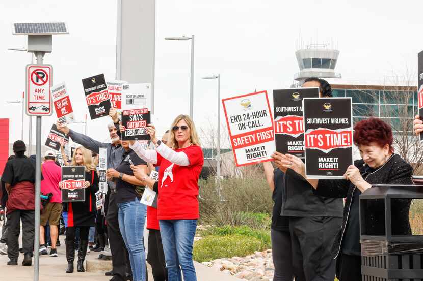 Southwest Airlines flight attendants picketing at the Dallas Love Field Airport in Dallas on...