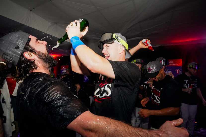 Texas Rangers third baseman Josh Jung (center) celebrates with catcher Austin Hedges in the...