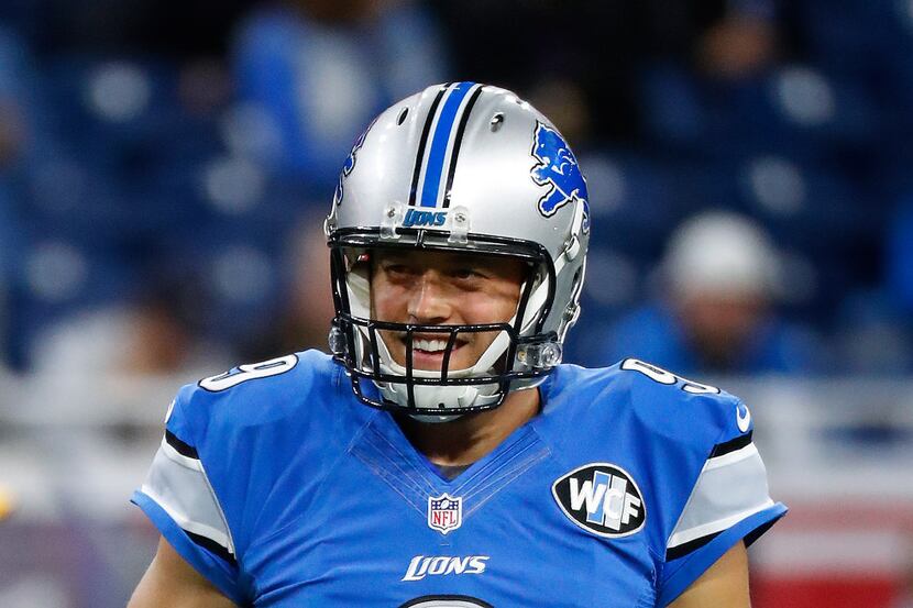 Detroit Lions quarterback Matthew Stafford (9) smiles during an NFL football game against...
