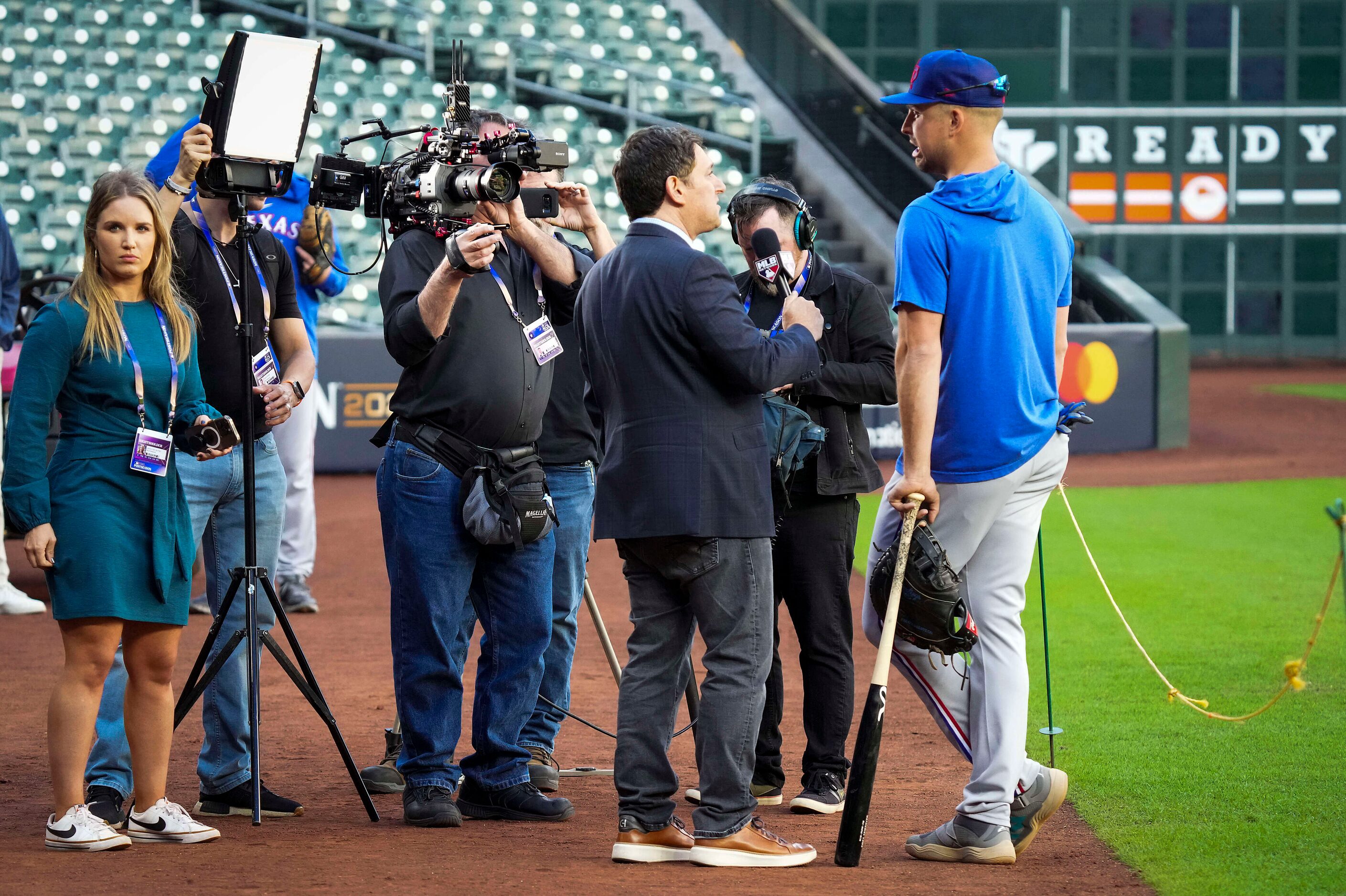 Texas Rangers first baseman Nathaniel Lowe is interviewed during a workout in preparation...