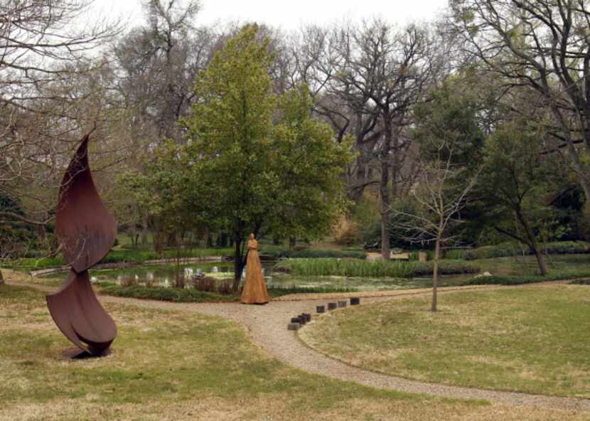 As visitors view the small lake at the Valley House Gallery and Sculpture Garden they will...