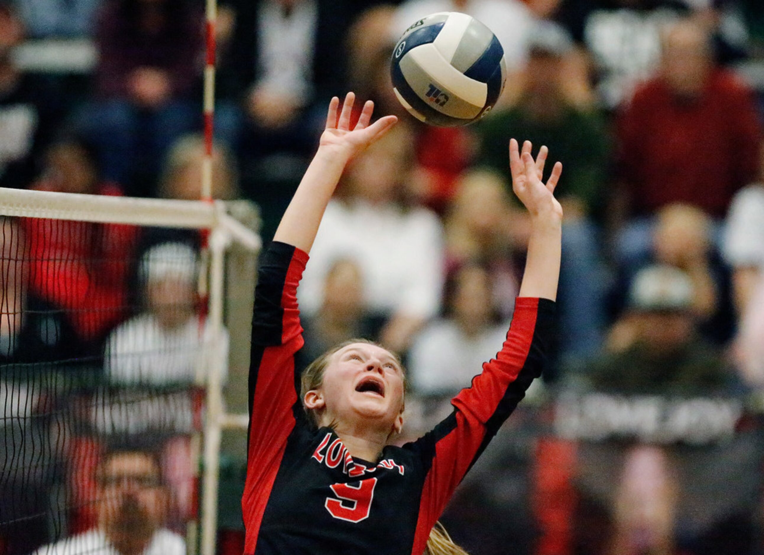 Lovejoy High School setter Averi Carlson (9) makes a set in game two as Lovejoy High School...