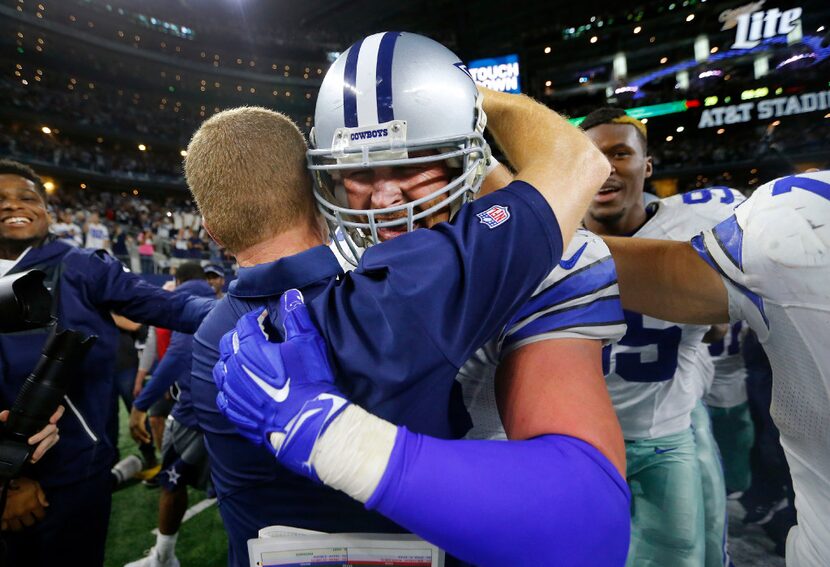 Dallas Cowboys tight end Jason Witten (82) is congratulated by head coach Jason Garrett...