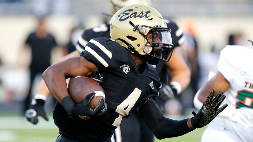 Plano East Senior High School running back Daniel Fayombo (4) carries the football during...