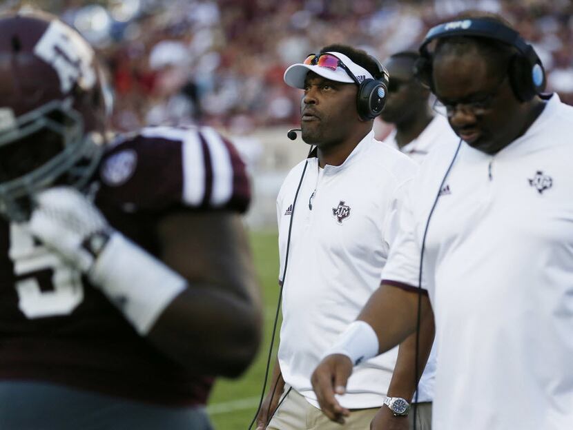 Texas A&M Aggies head coach Kevin Sumlin walks along the sideline during an NCAA football...