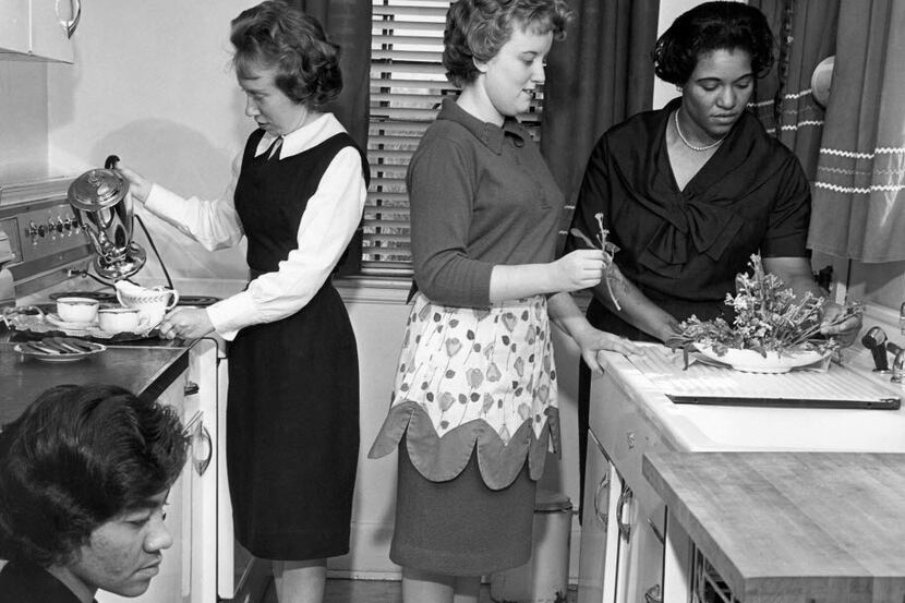 In March 1963, students participate in a home economics class at West Virginia State College...