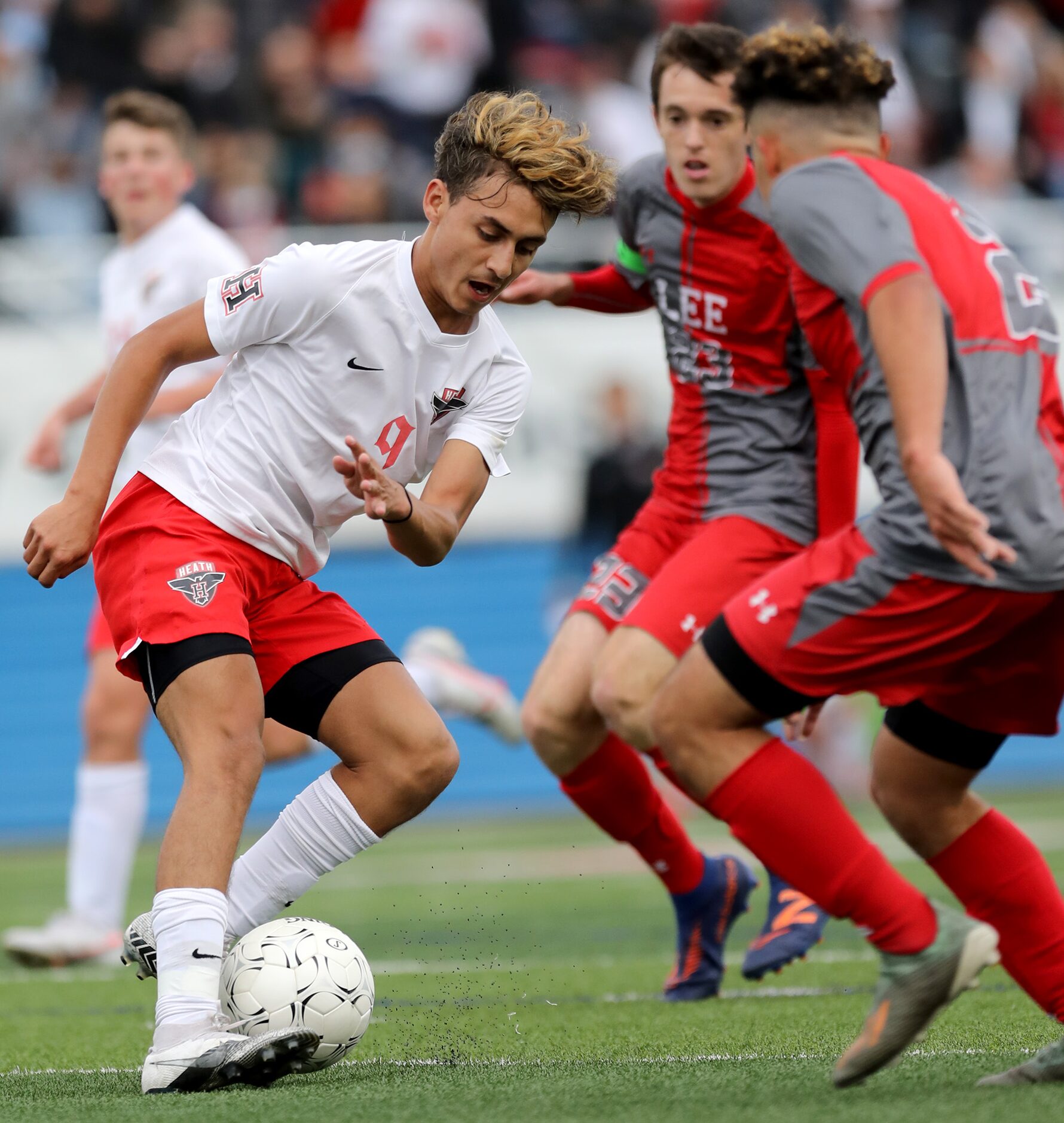 Rockwall-Heath's Chuy Ruiz (9) looks for room around SA Lee's Luis Cabrera (2) during their...