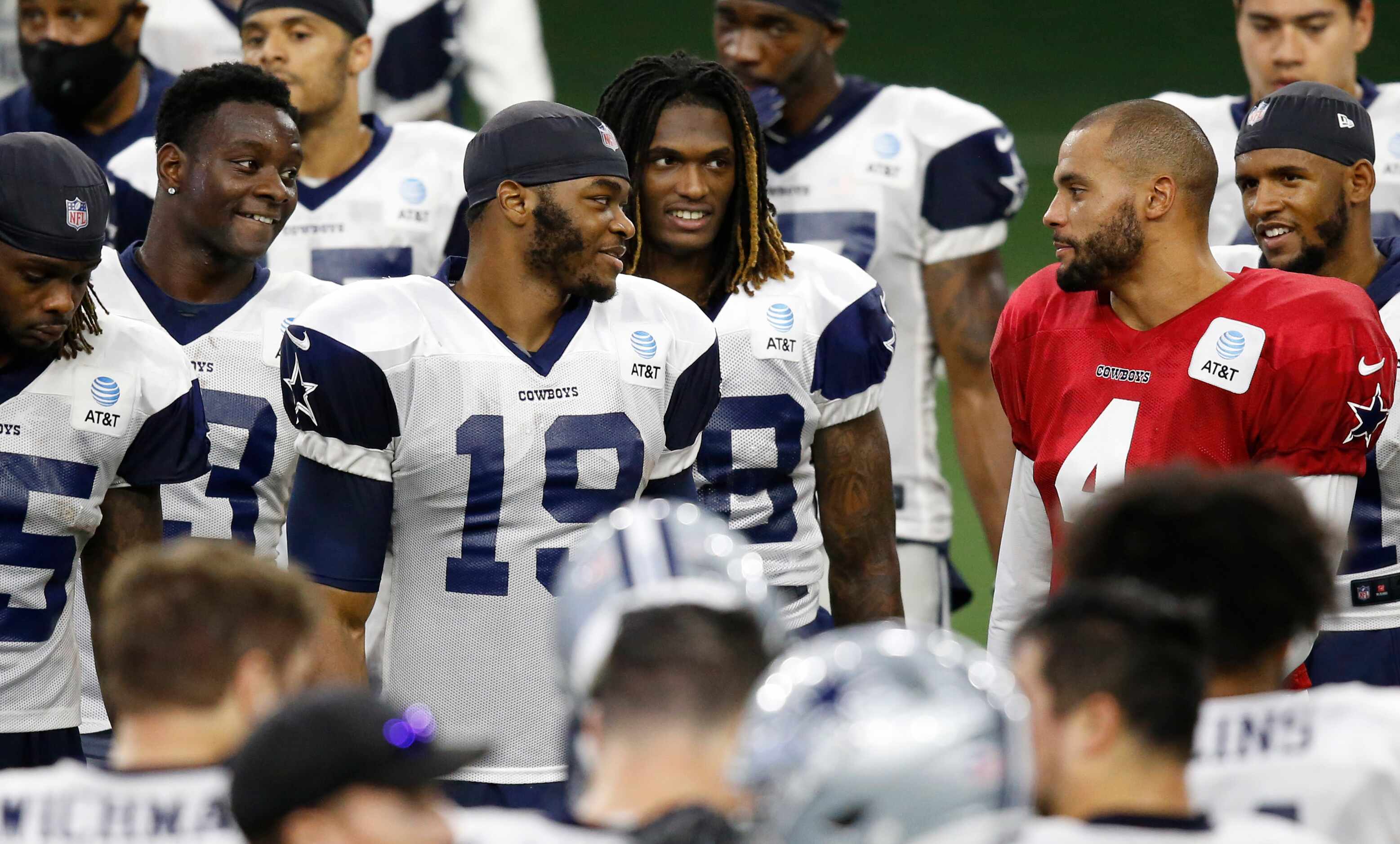 Dallas Cowboys quarterback Dak Prescott (4) talks with Dallas Cowboys wide receiver Michael...