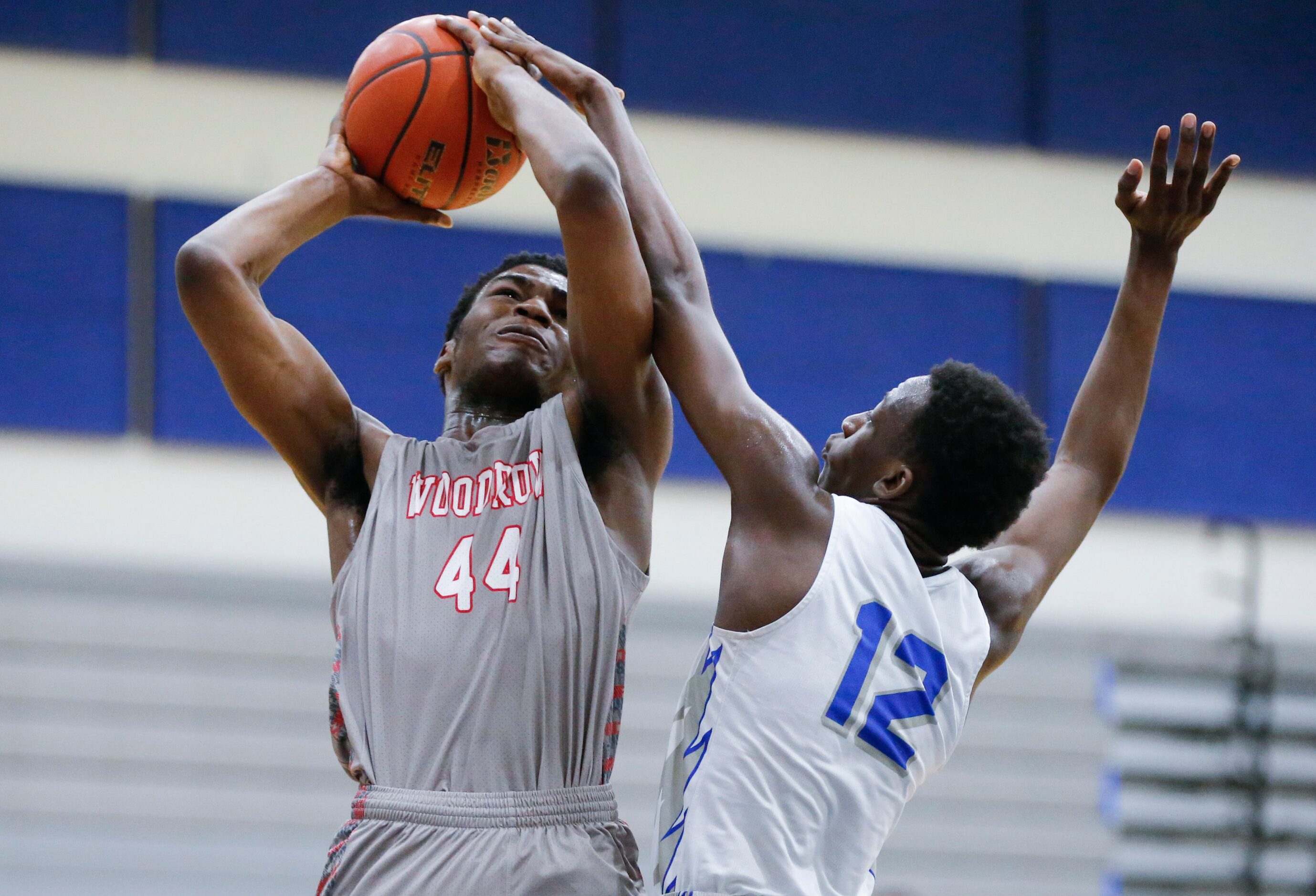 Woodrow Wilson sophomore forward Isaac Onuoha (44) attempts a shot as Conrad senior forward...