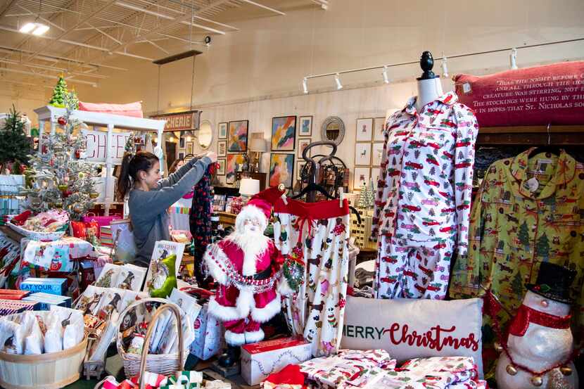 A customer peers at a shirt at The Sample House at Preston Oaks Shopping Center in Dallas,...